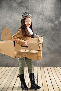 飞行员小孩时尚飞行员小女孩驾驶纸飞机背景