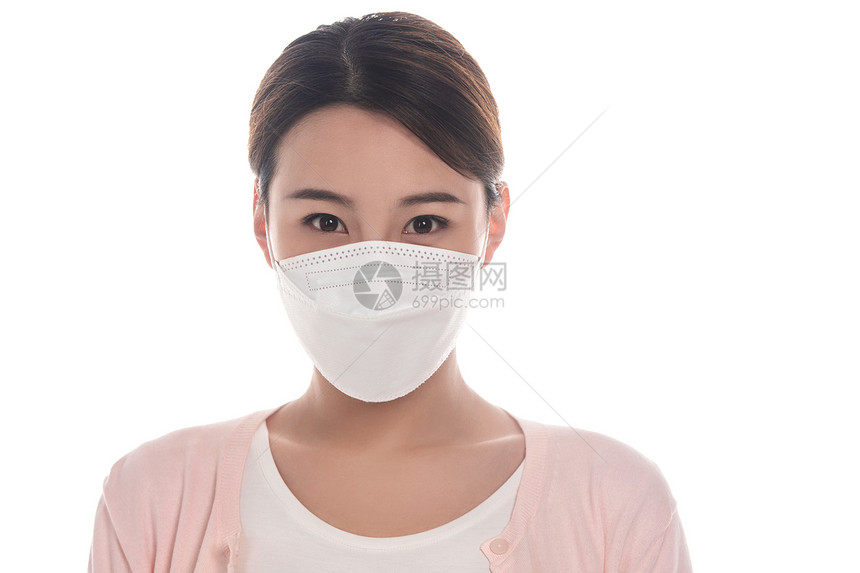 生病戴口罩的年轻女人肖像图片
