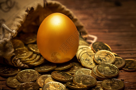 散落钱散落的金币和金蛋背景