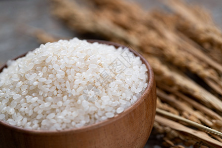 白色石板一碗大米和水稻背景