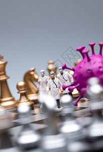 对抗流感国际象棋棋盘上的医护人员和病毒背景