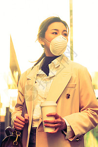 望防流感戴口罩的青年女人背景图片