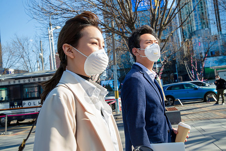 防流感口罩戴口罩的商务人士背景图片