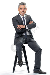 权威商务中老年男士坐在椅子上高清图片