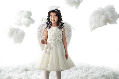 6岁到7岁魔杖仙女天使装扮的快乐小女孩图片