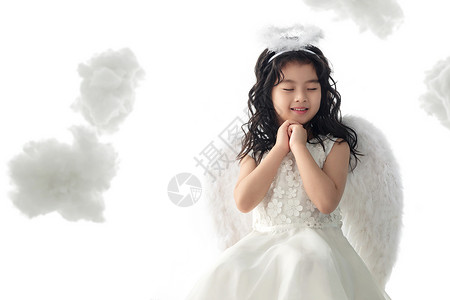 可爱的欢乐幸福快乐的小天使做祈祷图片