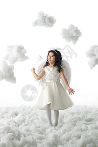七彩魔法棒影棚拍摄儿童仙女拿着魔法棒的快乐小天使背景