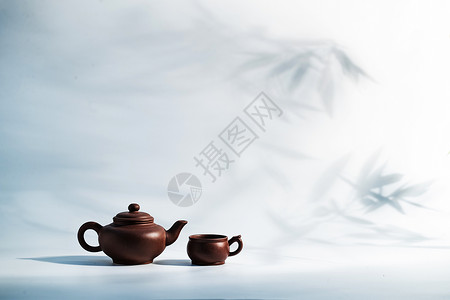 爆破效果元素东亚图片视觉效果紫砂壶竹子背景下的茶壶背景