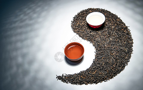 道教文化素材清新留白八卦茶叶和茶杯组成的太极图案背景