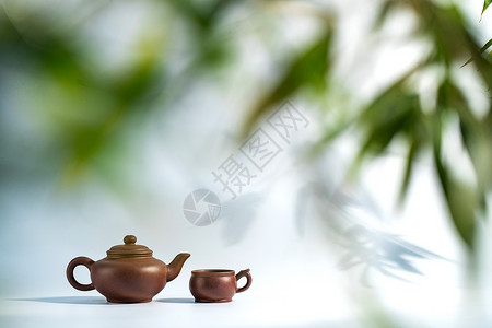 茶文化竹叶下的茶壶背景图片