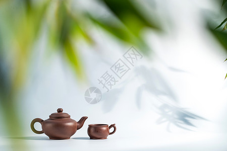 竹子制品瓷器陶瓷制品竹叶下的茶壶背景