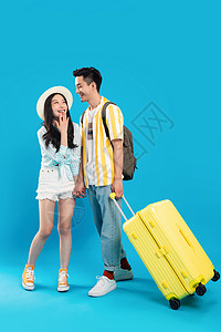 聊天箱休闲愉悦享受快乐的青年情侣拉着行李箱去旅游背景