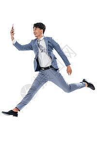 正装全球通讯拍照拿着手机奔跑跳跃的商务男士图片