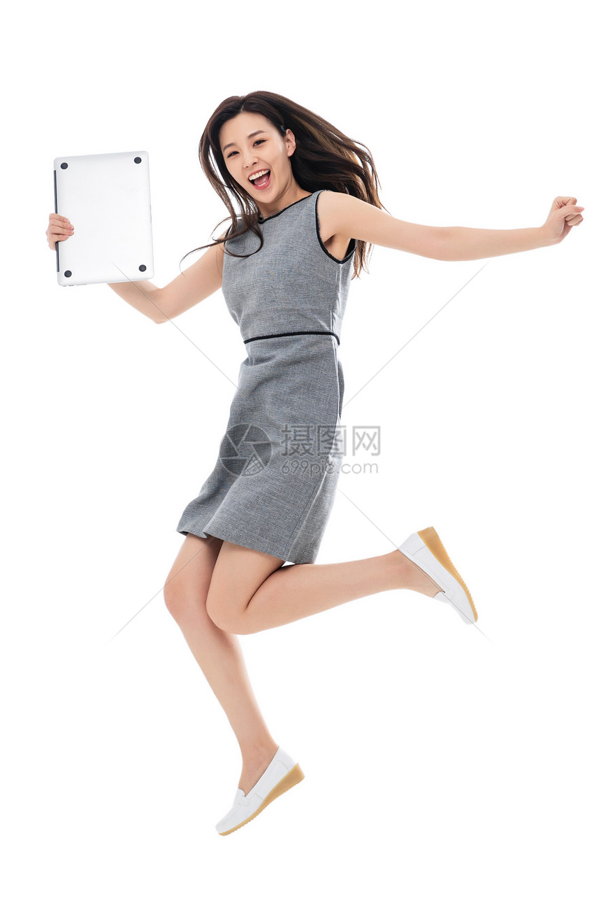 跳跃便利亚洲人拿笔记本电脑奔跑的商务女士图片