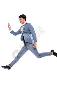 全球通讯通讯便利拿着手机奔跑跳跃的商务男士图片