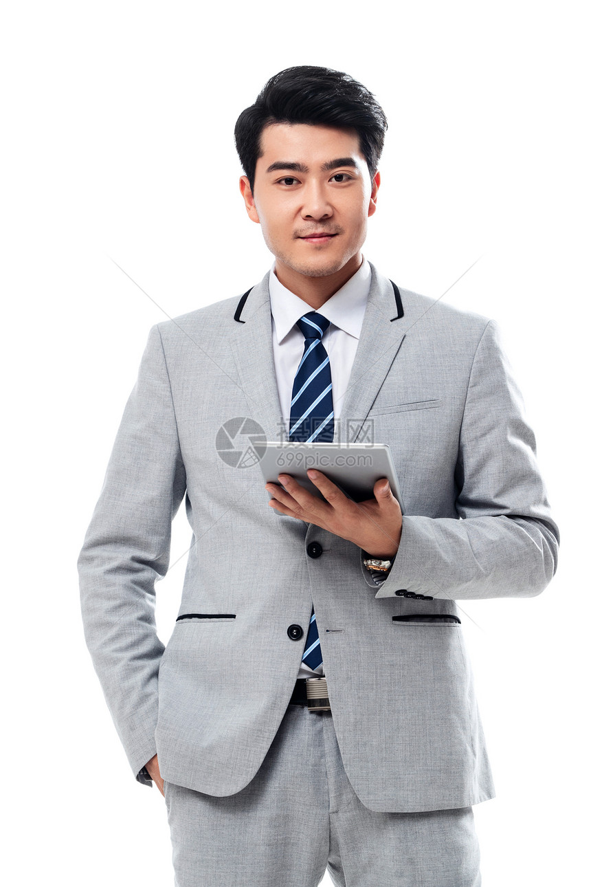 能力全球通讯东方人拿平板电脑的商务男士图片