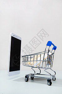 东亚网上购物经济购物车和手机银行卡图片