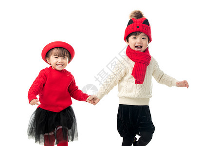 穿裙子的两个小姑娘人男孩女孩兄妹两人穿新衣服庆祝新年背景
