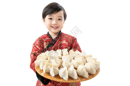 影棚拍摄食品高兴小男孩过年包饺子高清图片