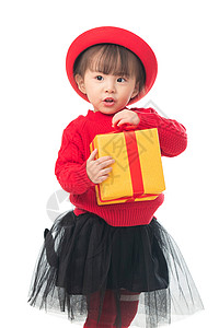 好奇心天真儿童可爱的小女孩拿着新年礼物图片