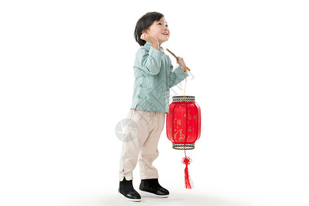 休闲活动亚洲喜庆一个小男孩手提红色灯笼庆祝新年图片