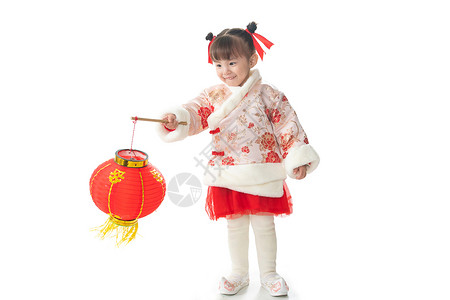 春节嬉戏的东方人一个小女孩手提红色灯笼庆祝新年高清图片