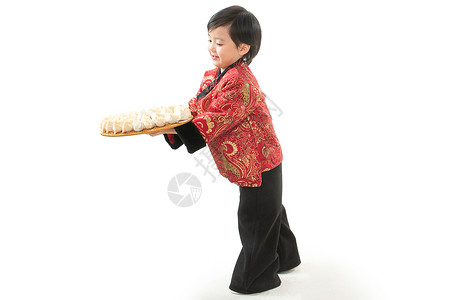 留白的饺子全身像幸福背景分离过新年的小男孩端着饺子背景