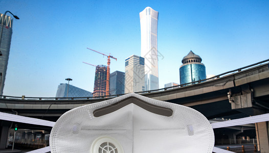 空气粘性飞盘城市建筑背景下的口罩背景
