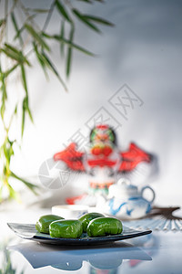 燕子植物彩色图片传统中华美食竹叶下的风筝和青团背景