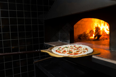 灶台火厨房烘焙烹饪餐厅里烤制披萨背景
