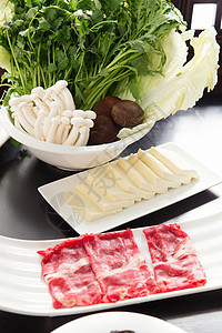 蔬菜豆腐火锅老北京美味羊肉火锅和食材背景