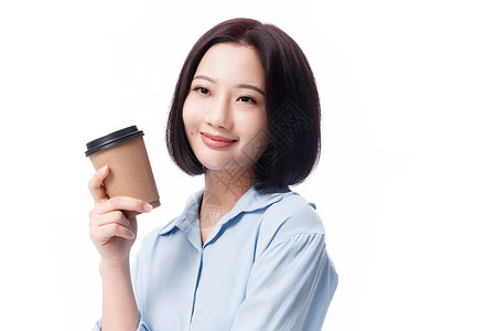 满意年轻女精力女白领手拿咖啡杯图片