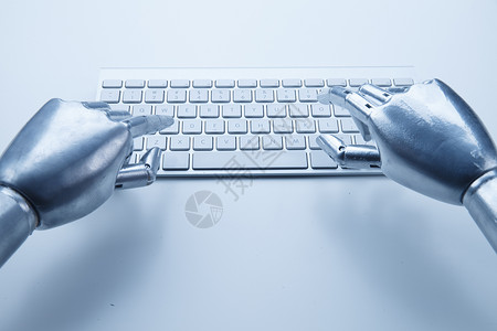 计算机机械手与键盘背景图片