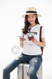 帽子拉杆箱遮阳帽青年女人旅行图片