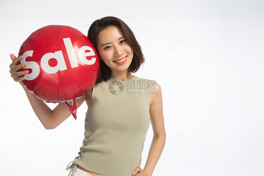 美女无忧无虑东方人快乐的年轻女孩拿着气球图片