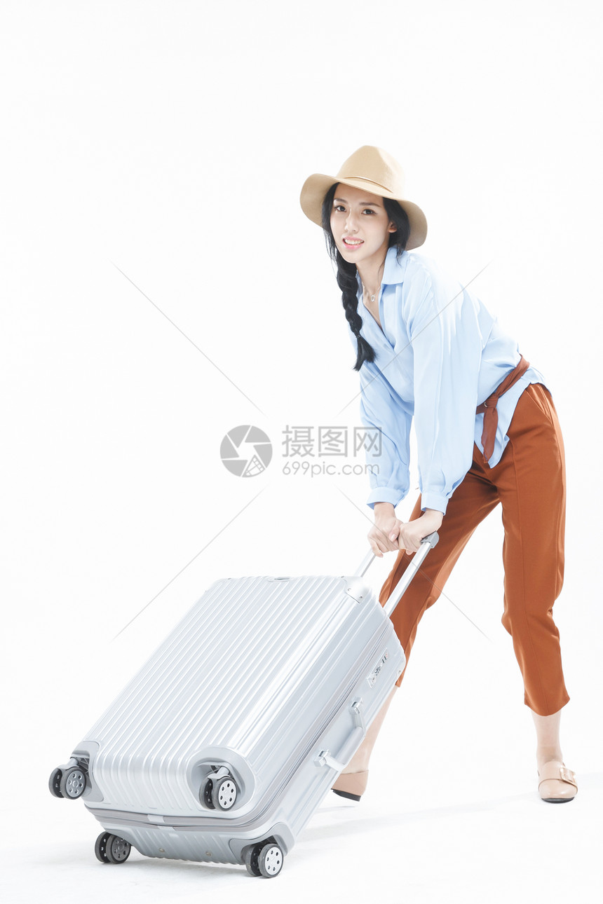 影棚拍摄时尚达人漂亮的青年女人旅行图片