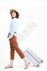 皮箱行李垂直构图青年女人旅行背景图片