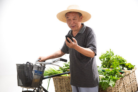 菜贩老农民拿着手机背景