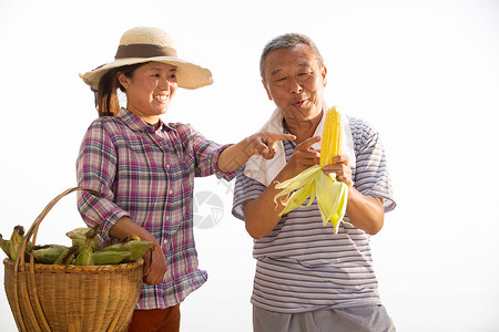 休闲装农业农民拿着玉米图片