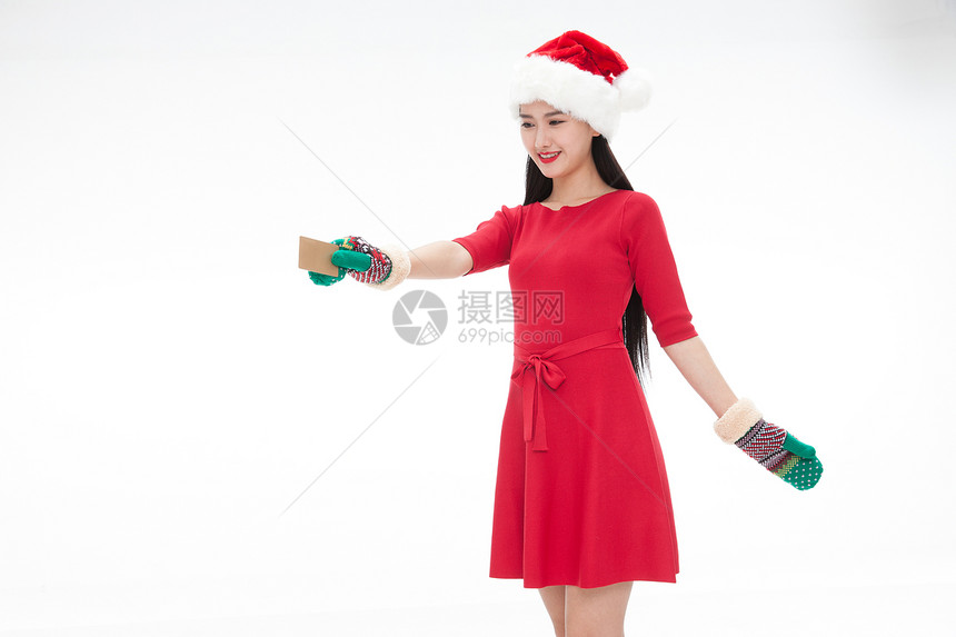 骄傲信用卡活力穿着圣诞服的青年女人拿着银行卡图片