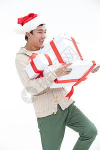 亚洲无忧无虑礼物拿着礼品盒的年轻男人图片