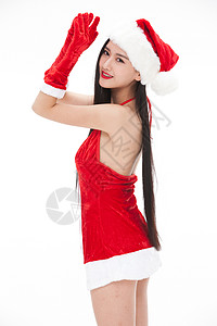 健康的圣诞节帽子穿圣诞服的年轻女人图片