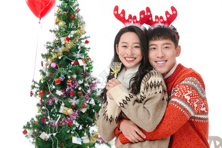 棒棒糖糖果树关爱满意树快乐的青年情侣过圣诞节背景
