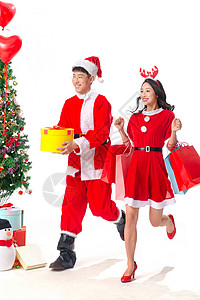 全身像购物两个人快乐的年轻人过圣诞节图片