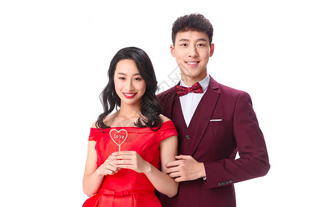 欢乐节日亚洲人浪漫情侣拿着心形棒棒糖图片