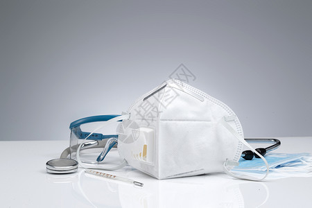 空袋子防护口罩和听诊器护目镜背景