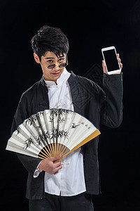 戏剧表演扇子东亚戴墨镜的青年男人图片