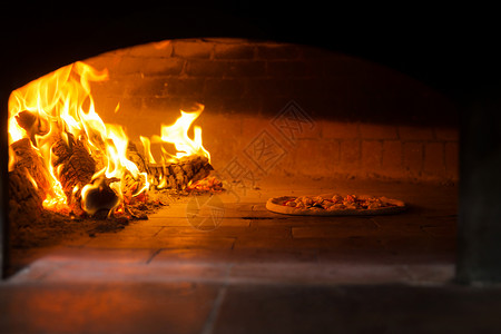 便携式烧烤炉子厨房快餐店东亚餐厅里烤制披萨背景
