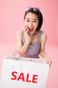 东方人购物节现代青年女人购物图片