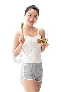 表现积极有机食品减肥青年女人吃沙拉图片